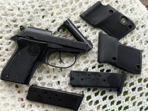 Beretta Tomcat 3032 Caliber Pistol with extra magazine and grips