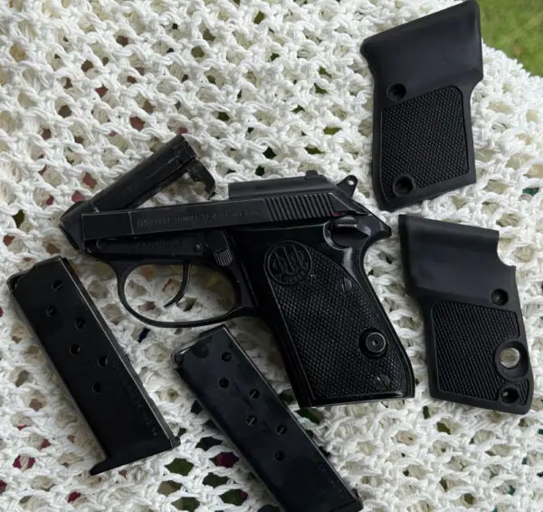 Beretta Tomcat 3032 Caliber Pistol with extra magazine and grips