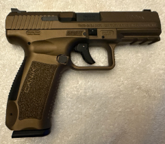 Canik TP9 DA 9mm pistol in like-new condition with two 18-round magazines and original factory case.