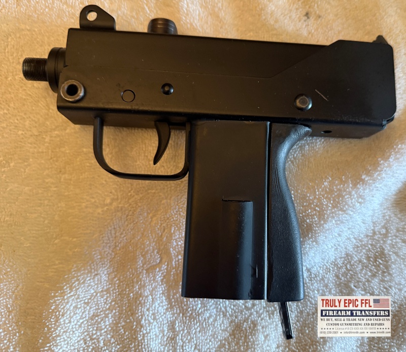 MasterPiece Arms Defender 9mm – Very Good Condition – Faux Suppressor, Extended Magazine & Original Case MasterPiece Arms Defender 9mm with faux suppressor, extended magazine, and original case.