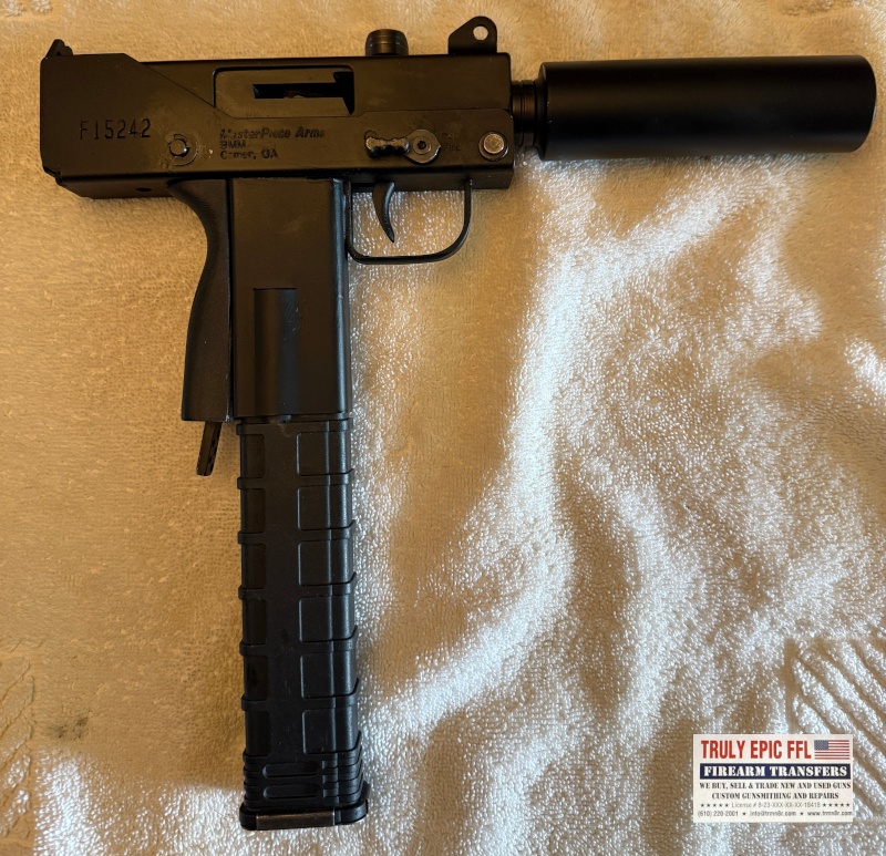 MasterPiece Arms Defender 9mm – Very Good Condition – Faux Suppressor, Extended Magazine & Original Case MasterPiece Arms Defender 9mm with faux suppressor, extended magazine, and original case.