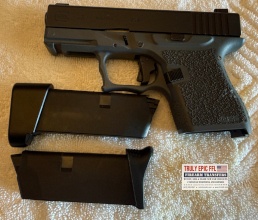 Available FireArms Two-tone Glock 43 9mm pistol in excellent condition with two magazines, waistband holster, and hard shell case.